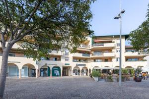 a large white building with trees in front of it at Appart Anglet in Anglet