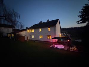 a house with a frisbee in front of it at Ferienhaus mit Whirlpool, Garten und großer Terrasse ruhig privat in Herbstein