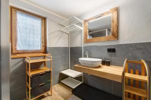 a bathroom with a sink and a mirror at Maison Olga in Valtournenche +32 photos