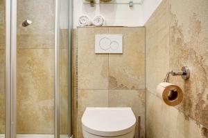 a bathroom with a toilet and a shower at Berghütte Waldhäuser in Neuschönau +24 photos