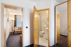 a bathroom with a toilet and a sink at Haus Erika in Stryck +77 photos