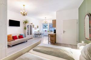 a bedroom with a bed and a living room at Garten Apartment in Kerken