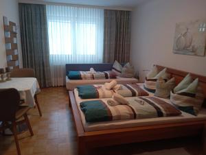 a living room with two beds and a couch at Ferienwohnung Lienbacher in Abtenau
