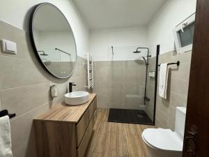 a bathroom with a sink and a mirror at Casa d’ avó Lita in Falcoeiras +37 photos