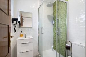 a bathroom with a shower and a sink at Apartamento nº2 - Seashel in Moncarapacho +12 photos