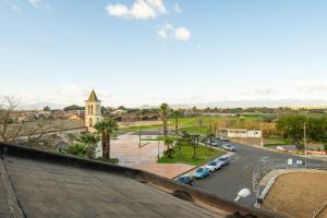 a view of a street with cars parked in a parking lot at Al Chiaro di Luna in Decimomannu