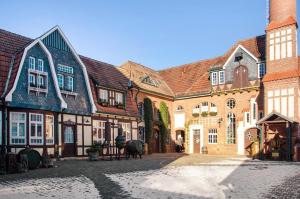 a group of brick buildings in a courtyard at Eichendorff Loft in Nordhausen