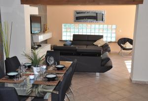 a living room with a couch and a table at Villa with private pool - near golf in San Miguel de Salinas