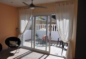 a room with a sliding glass door to a patio at Villa with private pool - near golf in San Miguel de Salinas +33 photos