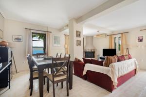 a living room with a couch and a table at Nikiana hideaway in Nikiana