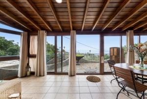 an open living room with a table and chairs at Apartamentos Los Aljibes in Las Tricias