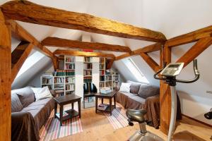 a living room with two couches and a table at Gut Rattelvitz - Parterre Ost in Gingst