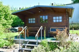 a tiny house with a pool in a yard at Fuchsbau Voßwinkel in Arnsberg