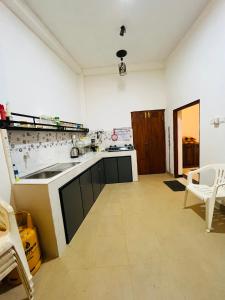 a kitchen with a sink and a counter top at Hamdan Villa in Dharga Town