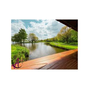 a view of a river from a bridge at Das Atelier in Ihlow