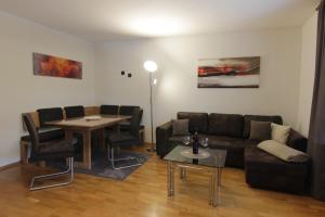 a living room with a couch and a table at Ferienwohnung Oberpfälzer Wald in Vohenstrauß