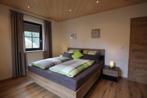 a bedroom with a large bed in a room at Ferienwohnung Oberpfälzer Wald in Vohenstrauß