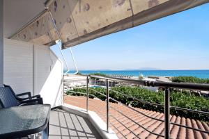 a balcony with a view of the ocean at Iguana studio 15 in Preveza