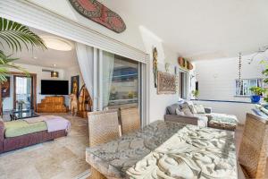 a living room with a couch and a table at Playa Graciosa in Arona