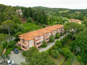 an overhead view of a large building with an orange roof at Villetta a Castiglioncello in Castiglioncello