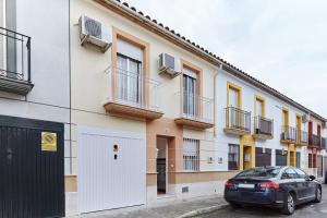 a car parked in front of a building at Casa López in Baena