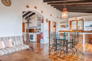 a living room with a table and a couch at ses llebres in Bunyola