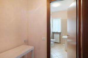 a bathroom with a toilet and a sink at Il Frutteto 49 in Ortovero