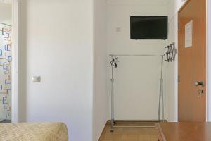 Un televizor și/sau centru de divertisment la Casa Margarida Malveiro