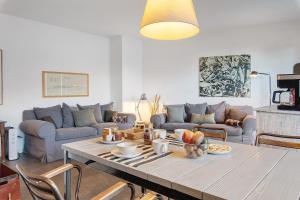 a living room with a table and a couch at Charming Lake View Bellagio in Bellagio +20 photos