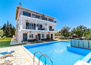 an image of a villa with a swimming pool at Groundfloor Studio 1 in Tsoukalades