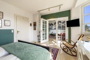 a bedroom with a bed and a green wall at Attendorner Burgblick in Attendorn