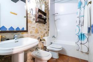 a bathroom with a sink and a toilet at Moli d' en Pi in Morella