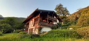 a house with a balcony on the side of it at Haus Sunnleitn Vogelsang in Bayrischzell