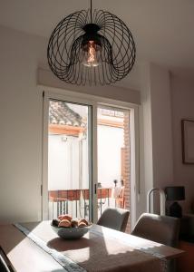 a bowl of fruit on a table in a dining room at Casa de Manuel in Pinos Genil +24 photos