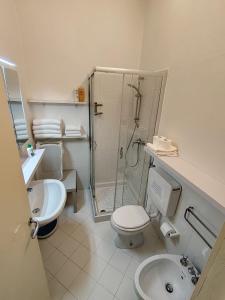 a bathroom with a shower and a toilet and a sink at DolceVita Apartments N 241 in Venice