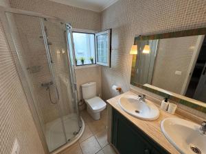 a bathroom with a shower and a toilet and a sink at Apartamento Cipreses in Puerto del Carmen +15 photos