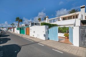 a row of white houses on a street at Apartamento Cipreses in Puerto del Carmen