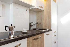 a kitchen with a sink and a counter top at Kardinerhof in Collalbo +71 photos