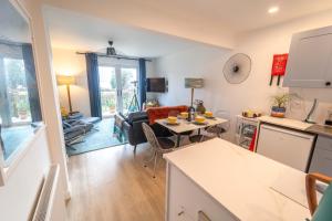 a kitchen and a living room with a table at Faodail in Onich