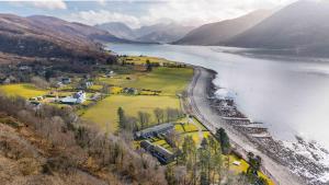 an aerial view of a lake with a train at Faodail in Onich