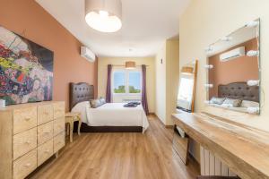 a bedroom with a bed and a large window at Nikydan in Cala d´Or +22 photos