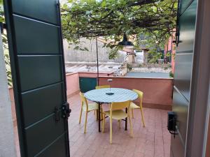 a table and chairs sitting on a patio at DolceVita Apartments N 241 in Venice