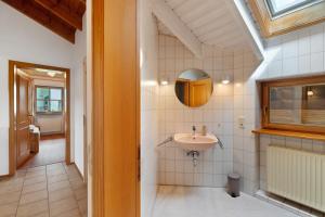 a bathroom with a sink and a mirror at Felsenland Idyll in Erfweiler