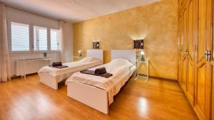 a bedroom with two beds and a window at Costacabana - Villa Abigail in Lloret de Mar +20 photos