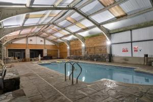 a swimming pool with a glass ceiling at finest Retreats - Trimstone Manor, Lee Studio Apartment in Woolacombe