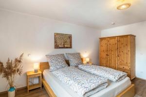 a bedroom with a large bed with two pillows at Pfälzerwald Idyll in Schwanheim