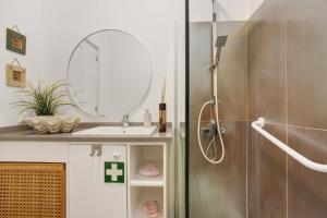 a bathroom with a sink and a mirror at A Minha Casa in Funchal +22 photos