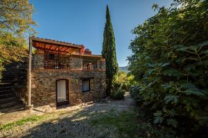 an external view of a stone house with a balcony at Villa Casablanca in Montferrer