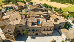 an aerial view of a village with tiled roofs at Cal Comorera in Masoteras