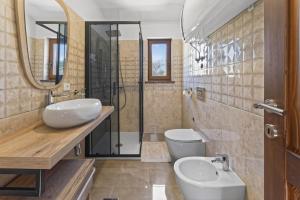 a bathroom with a sink and a toilet and a mirror at Holiday Home Pahari by Rent Istria in Roč +35 photos